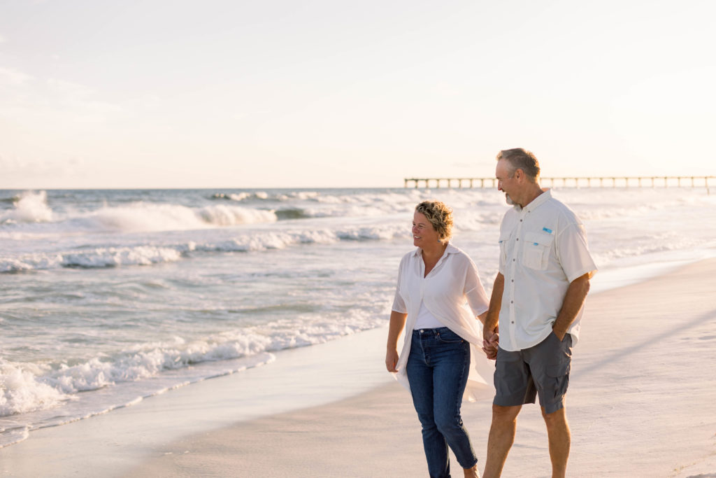 Mom and Dad walking hand in hand on Navarre Beach