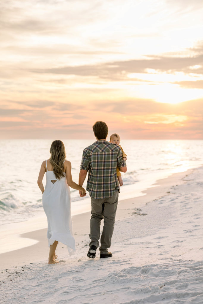 Family walking at sunset on Pensacola Beach Photoshoot