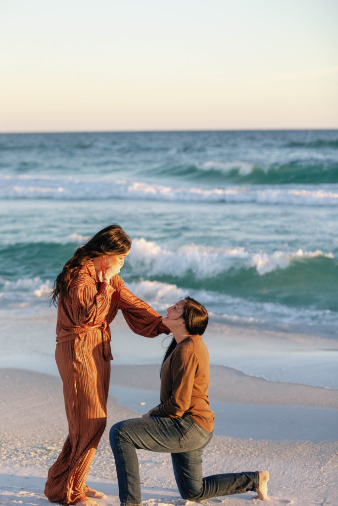 woman proposing to another woman on pensacola beach