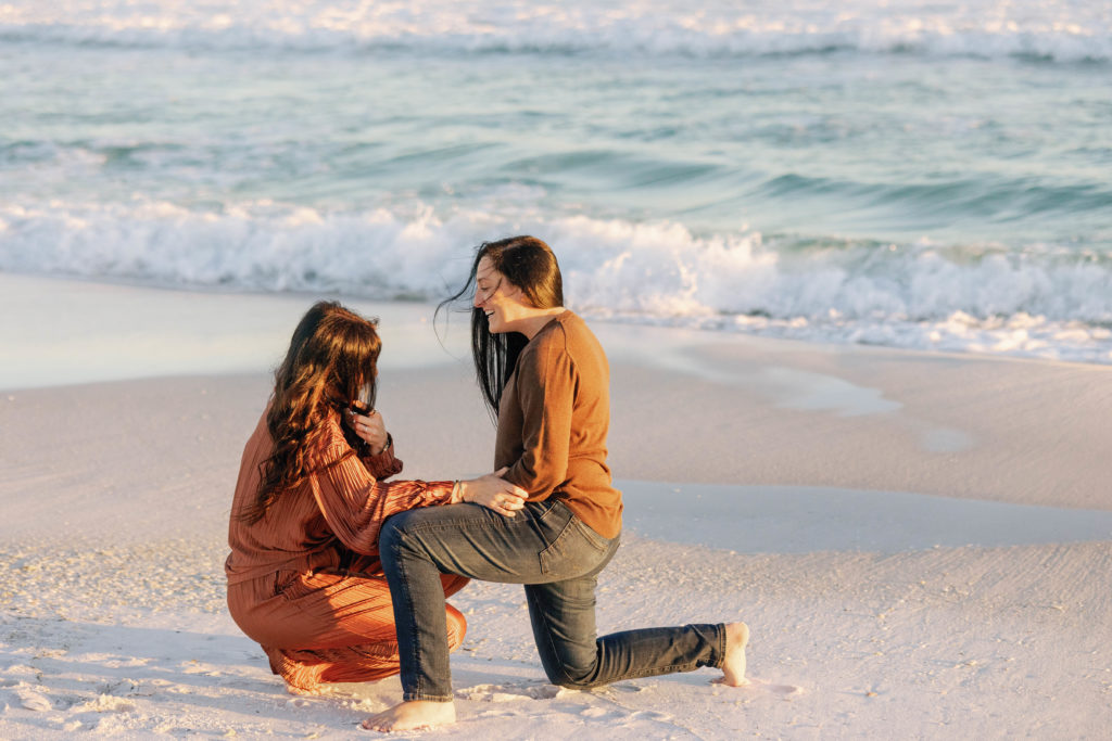 Gay couple getting engaged on pensacola beach