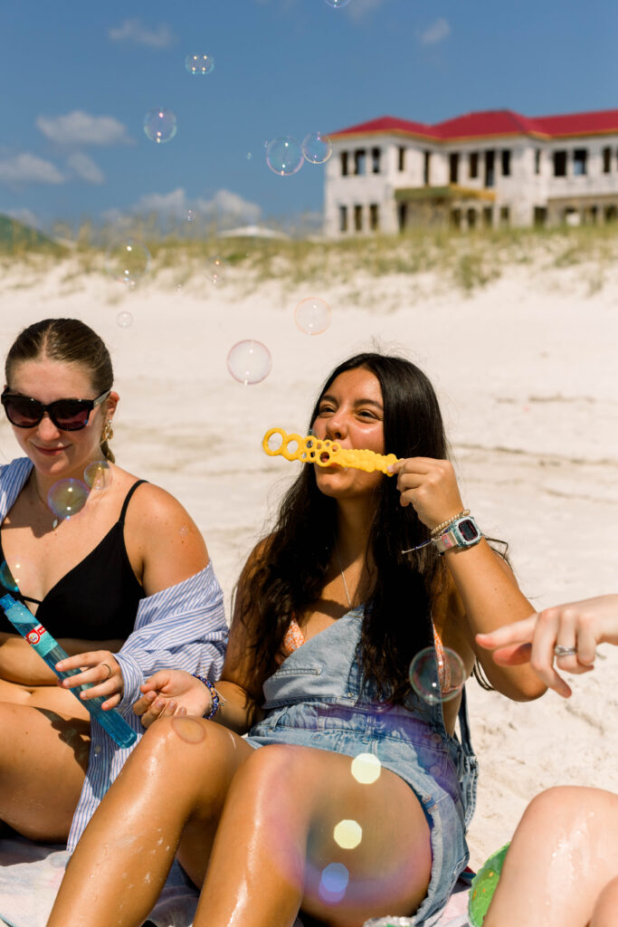 Girl blowing bubbles on Pensacola Beach