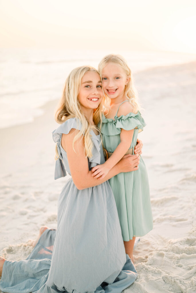 Sisters posing on Pensacola Beach for Family Photos