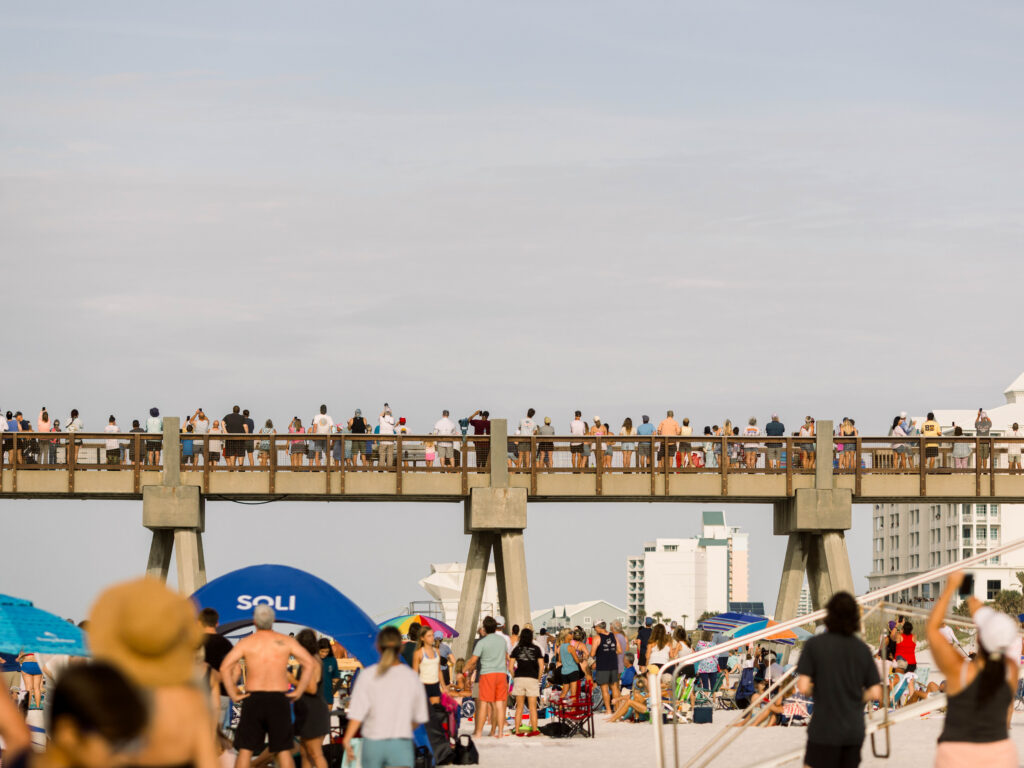 Photographers line the pier in Pensacola for Breakfast with the Blues